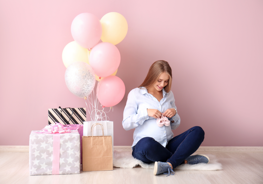 Beautiful,Pregnant,Woman,With,Baby,Shower,Gifts,Near,Color,Wall